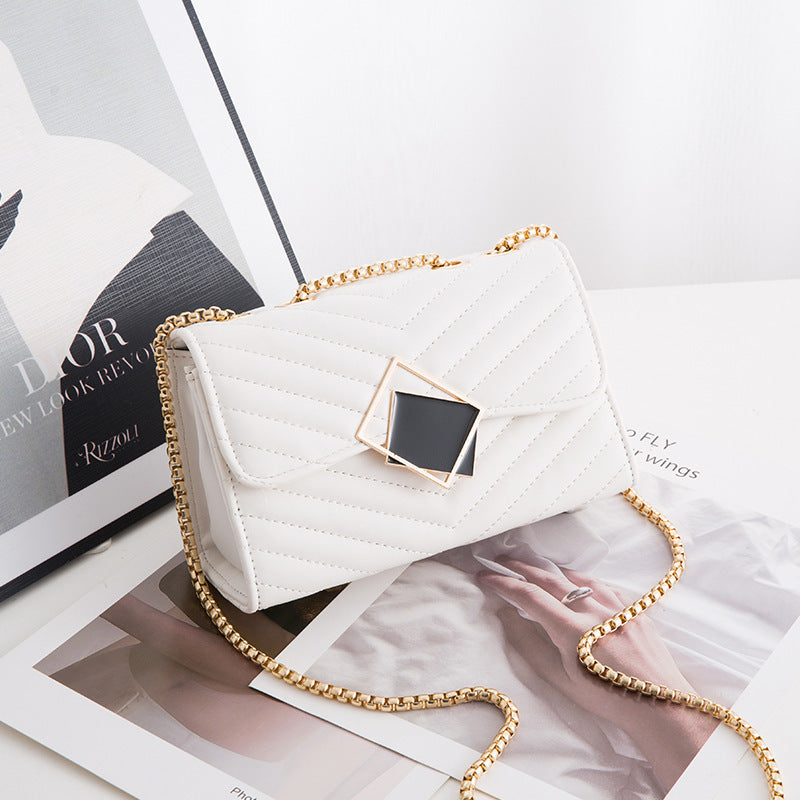 Elegant Quilted Crossbody Bag with Geometric Accent and Gold Chain Strap